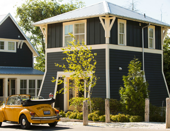 Yellow slug bug in front of a unique Seabrook home