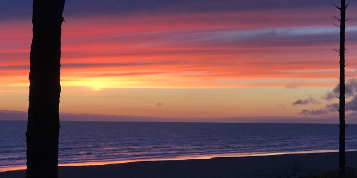 Oranges and purples dancing off the sky as the sun sets in Seabrook