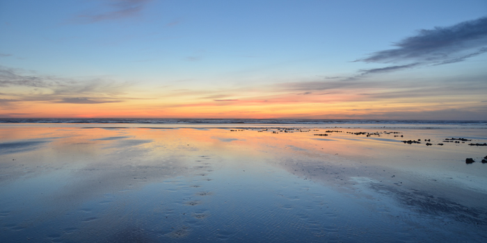 The sun going down over the massive Pacific Ocean