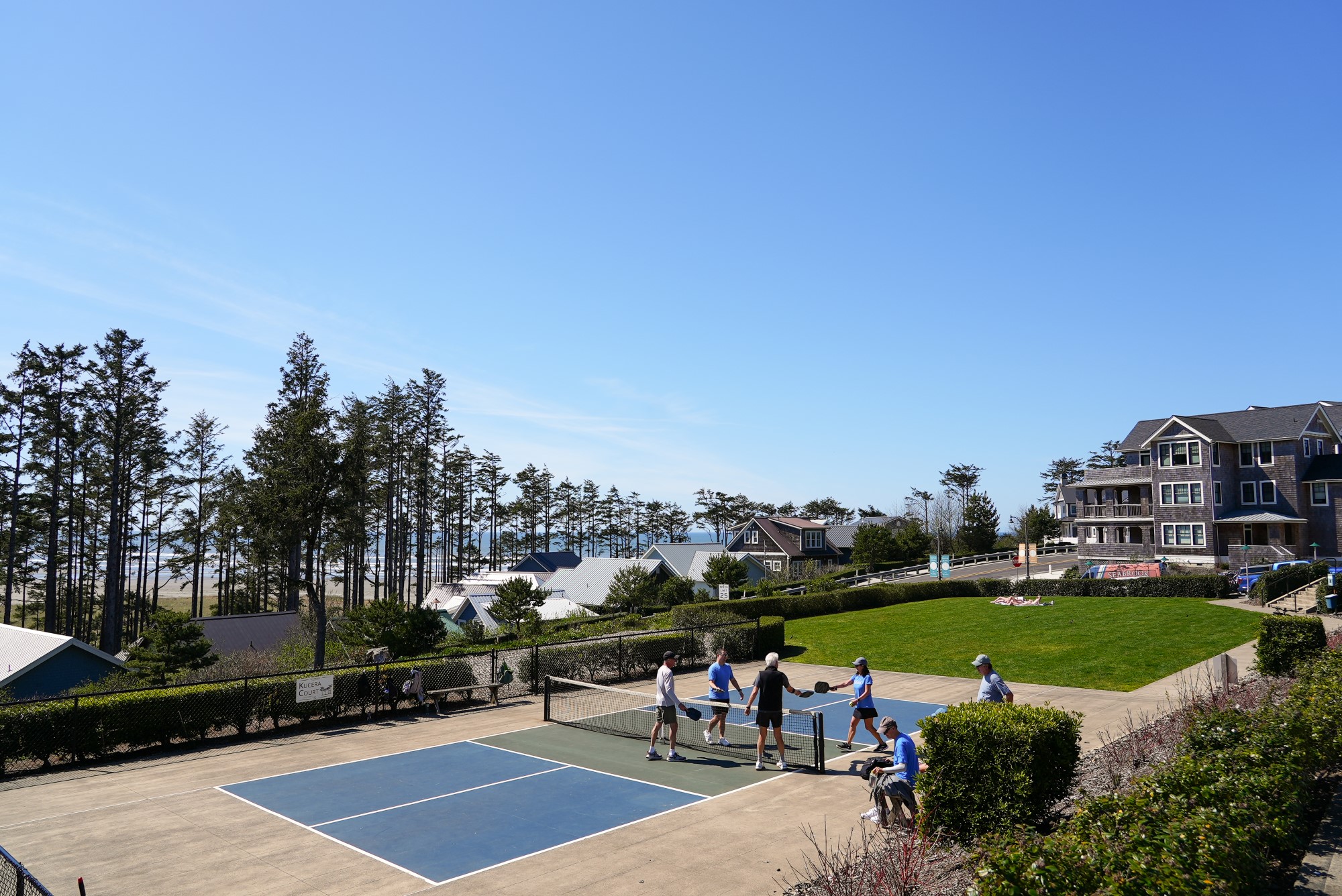 Players on the outdoor pickleball court at Kucera Park in Seabrook